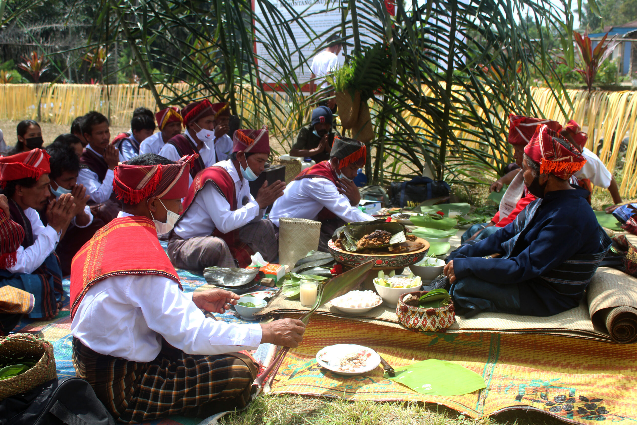 People in Sihaporas village held a ritual, part of their ancestral traditions. They are still fighting for the return of their customary land. Image by Tonggo Simangunsong.