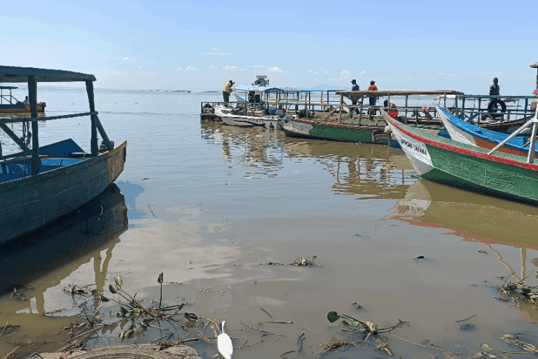 Fishers in Dunga on the shores of Lake Victoria. Image by Achieng’ Otieno for Mongabay.
