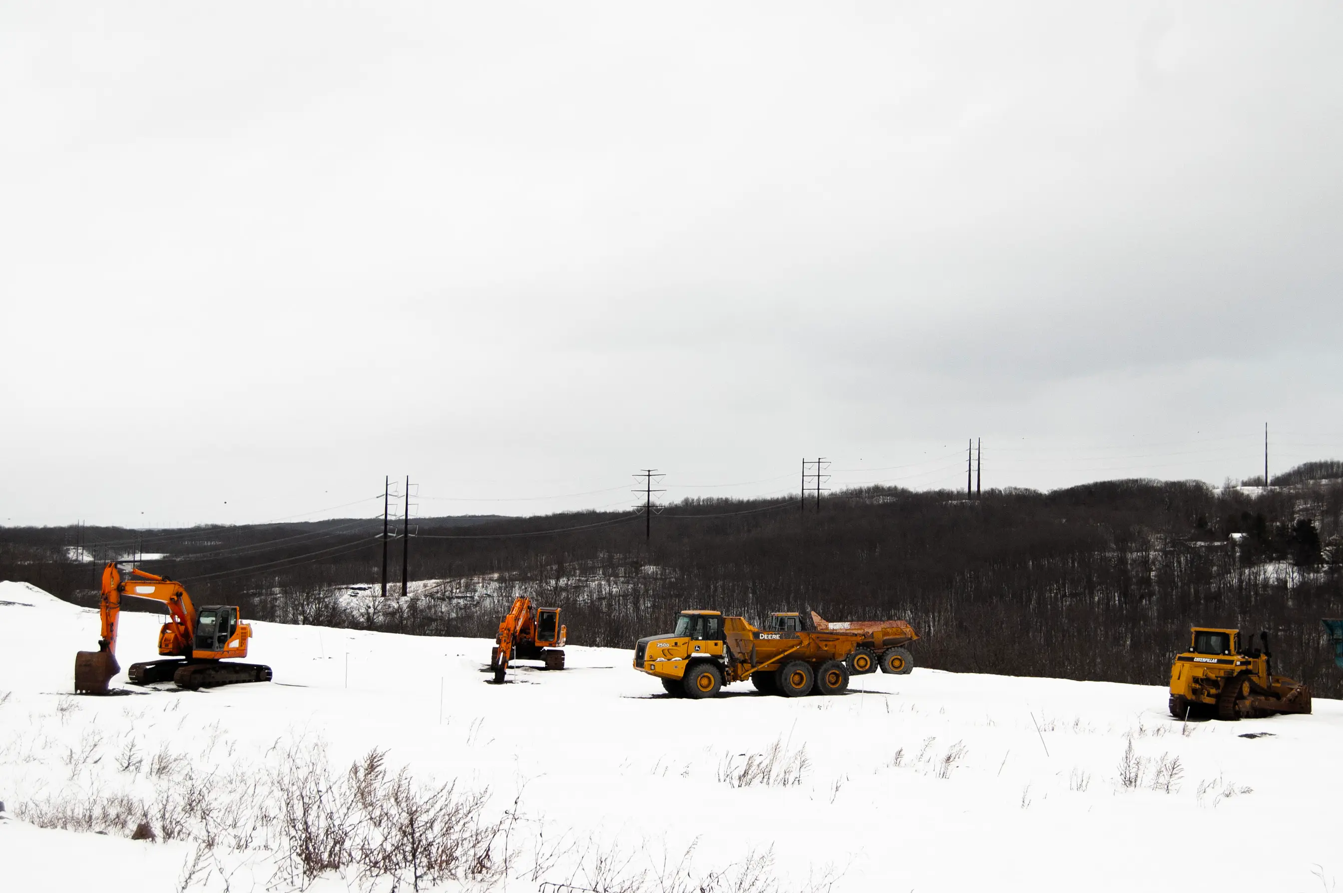A high-voltage power line runs behind a construction site in Archbald, Pennsylvania.