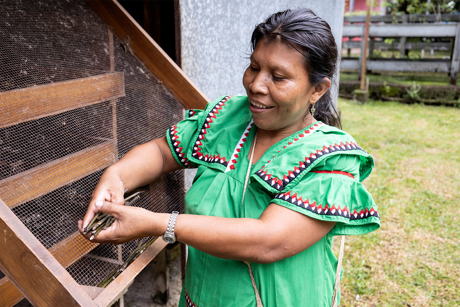 Matilde Amador, an ASASTRAN midwife, holds a plant known as the “regulator” that is used during childbirth and labor.