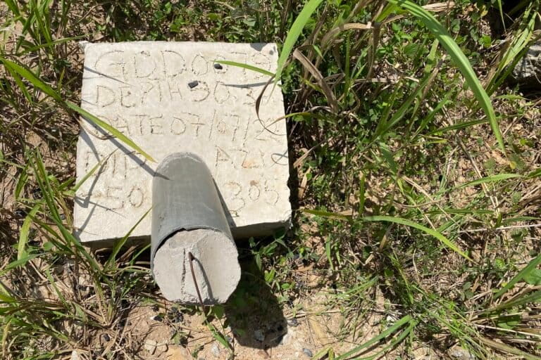 In its initial site survey, Atlantic Lithium dug holes 90 meters (300 feet) deep to prospect for the lithium. These markers are scattered throughout the mining area. Image by Maxine Betteridge-Moes for Mongabay.