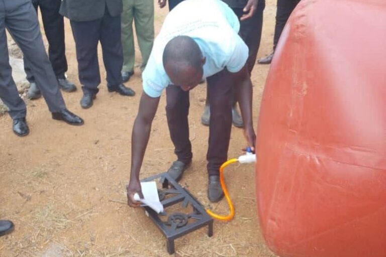 Community members test the biogas system in Nkhundye village. Image courtesy of Biogas Technology in Zambia.