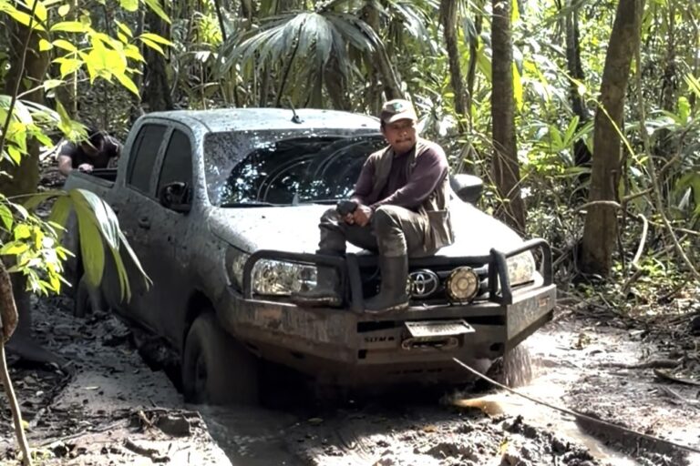 A ranger vehicle stuck in the mud in Laguna del Tigre National Park in January. Image by Maxwell Radwin. 