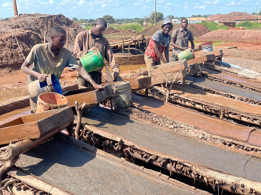 Small-scale miners in Shinyanga District Council, panning soil believed to contain gold. Image courtesy of Shaaban Njia.
