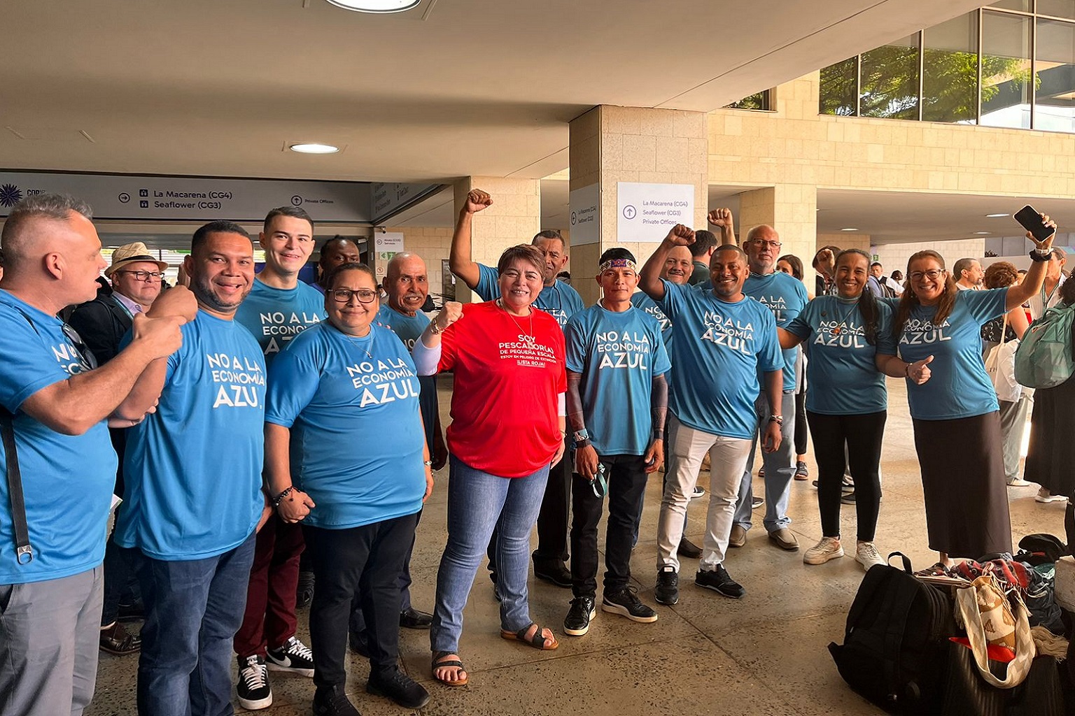 Small-scale fishers gather in “No to the Blue Economy” T-shirts at the 16th conference of the parties to the U.N. Biodiversity Conference in Cali, Colombia, in 2024. The backs of the shirts list the activities they’re opposed to: mass tourism, offshore energy production, unsustainable industrial fishing, deep-sea mining, fishmeal factories and large-scale aquaculture. Small-scale fishers wore these T-shirts at the United Nations Ocean Conference in Nice, France, in June 2025, despite conference organizers attempting to restrict their use, according to Vivienne Solis Rivera, a representative of CoopeSoliDar, a Costa Rica-based NGO.